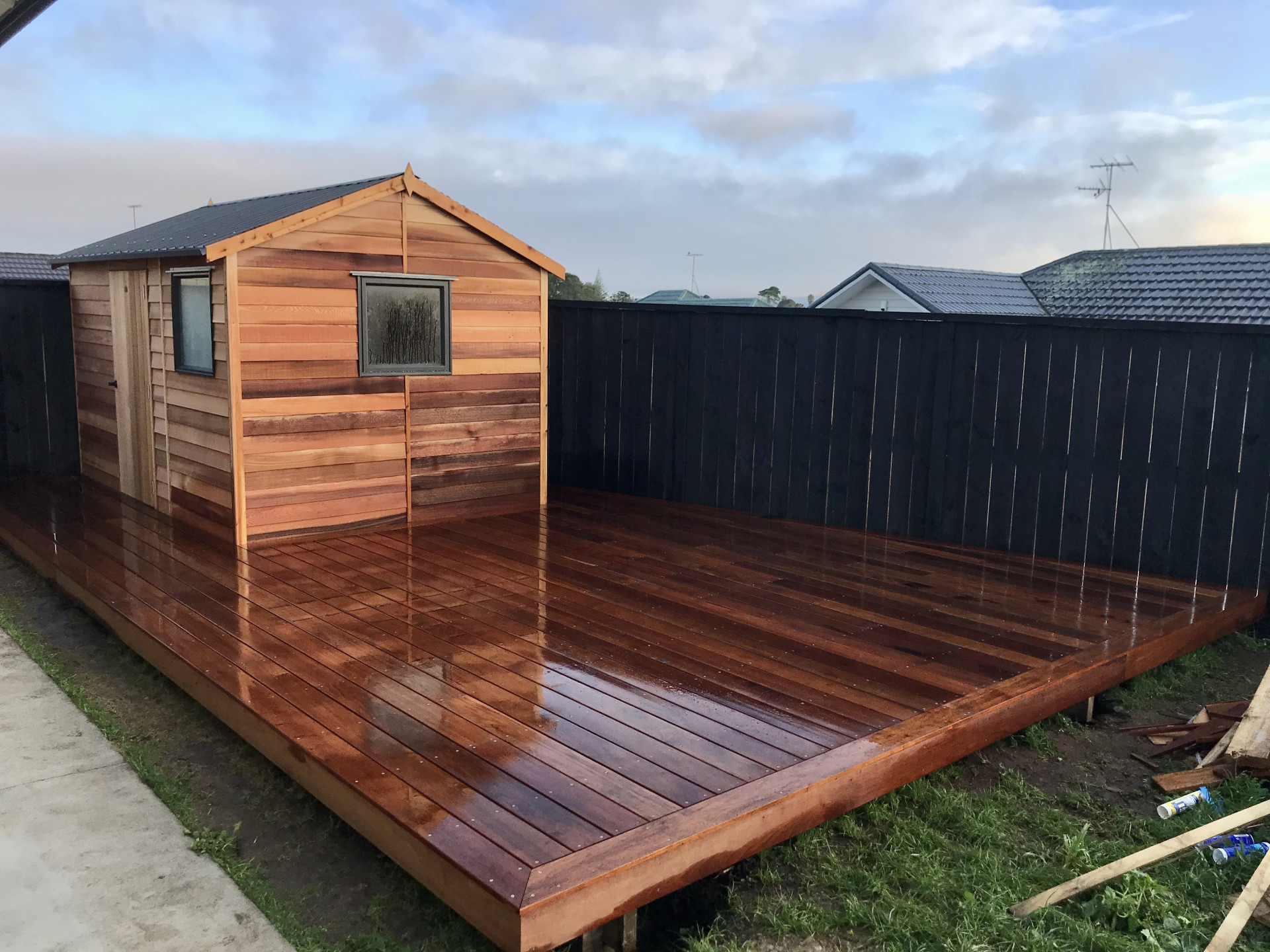 Newly completed hardwood timber deck and cedar shed installation at a residential property in Auckland built by Masterscape